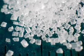 A crystal of sucrose (sugar)